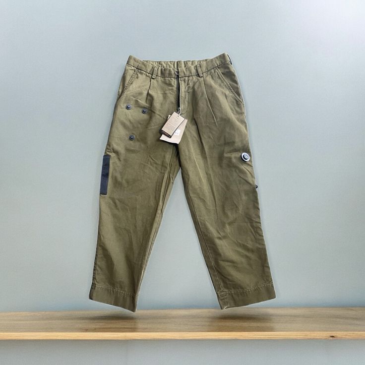 Nwt!! Loose Chino 100% Cotton Color Dark Olive. Embellished Button Details Size Small Measurements Approximately Laying Flat Waist 15” Inseam 25” Rise 10.5” Retails $393 Casual Khaki Pants With Buttons, Casual Cotton Cargo Pants With Buttons, Cotton Cargo Pants With Buttons For Workwear, Casual Ankle-length Pants With Buttons, Khaki Straight Leg Bottoms With Buttons, Khaki Workwear Pants With Buttons, Casual Cargo Pants With Button Closure For Work, Utility Style Khaki Bottoms With Buttons, Utility Straight Leg Pants With Buttons