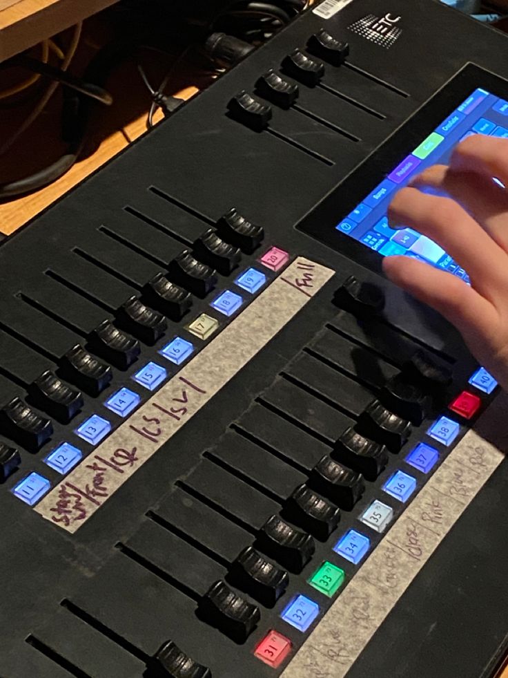 a person using a computer keyboard with many buttons