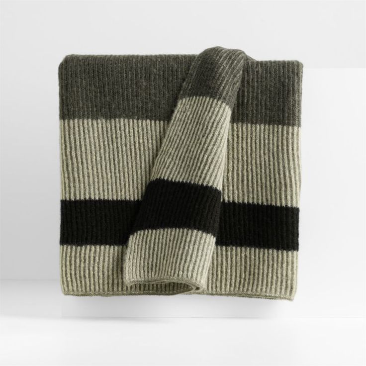 a blanket with black and white stripes on it