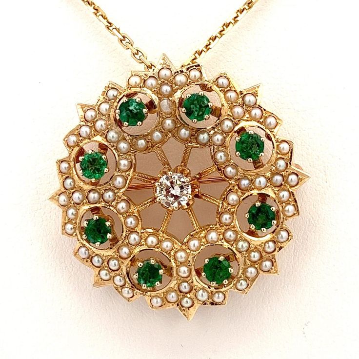 "Ornate Diamond Pendant/Pin/Brooch 2.14 CTW in 14k Yellow Gold | Estate Jewelry ET1033 Step into the enchanting world of antique jewelry with this exquisite Emerald, Diamond, and Seed Pearl Pendant/Pin/Brooch. Meticulously crafted in 14k yellow gold, this rare piece encapsulates the charm and elegance of a bygone era.  There is a beautiful sparkling diamond in the center paired with captivating emerald gemstones, known for their deep green hue and symbolizing love and rebirth, radiating a mesmer Elegant Yellow Gold Jewelry With Historical Design, Victorian Yellow Gold Brooches With Gemstone, Yellow Gold Filigree Brooches For Wedding, Wedding Yellow Gold Filigree Brooches, Elegant Yellow Gold Baroque Brooches, Antique Yellow Gold Brooches With Gemstone, Heirloom Yellow Gold Gemstone Brooches, Heirloom Yellow Gold Jewelry With Historical Design, Yellow Gold Jewelry With Historical Design For Anniversary