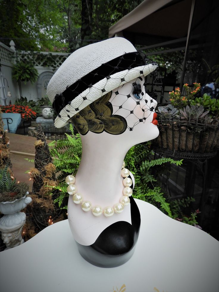 "LOVELY Classy Vtg 1940's Ladies White & Black Velvet Ribbon Woven Veiled Bumper Hat sz 21\" Diameter This is such a fun vintage Bumper hat from the 1940's. It's in just impeccable condition with no flaws I could note what so ever. The hat is a bright white woven fabric which feel synthetic to me. It has a short little brim which tilts up slightly at the sides with a gorgeous black veil attached to the front of the hat. There's a beautiful black velvet ribbon round the crown of the hat with Vintage White Costume Hat With Short Brim, Vintage Flat Brim Costume Hats And Headpieces, Vintage Flat Brim Fitted Costume Hat, Fitted Vintage Costume Hats With Flat Brim, Vintage Fitted Costume Hat With Flat Brim, Retro Mini Hat With Short Brim, Retro Costume Hats For Kentucky Derby, Vintage White Brimmed Costume Hats And Headpieces, Vintage White Brimmed Costume Hat