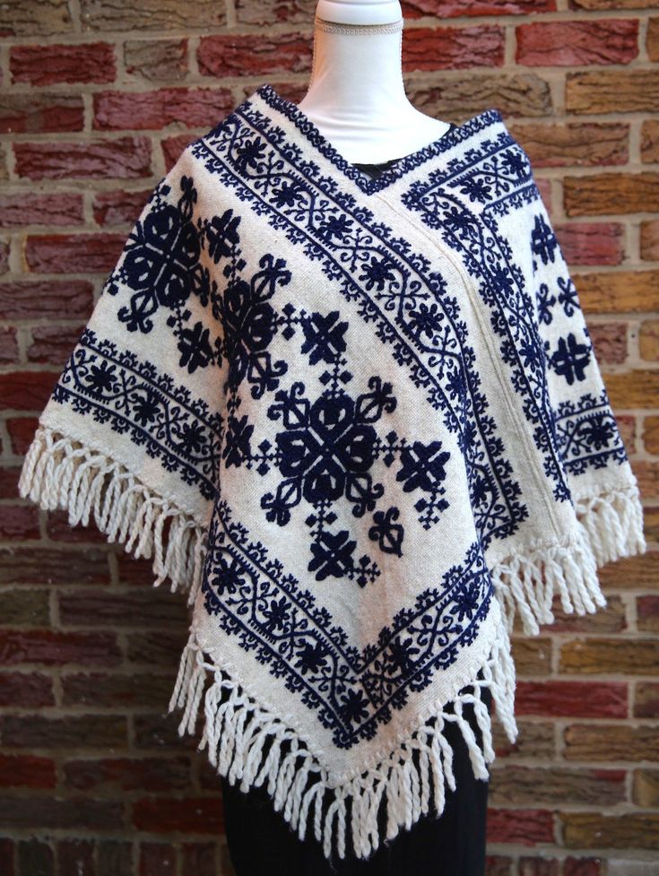 These authentic "Quexquemetl" are handwoven by indigenous artisans in Hueyapan Puebla. Every design is unique, embroidered with creativity, love and incredible skill. Simply beautiful! Measuring approximately 34" wide by 26'' long, one size should fit all adults. Folk Style Handwoven Shawl, Handwoven Folk Shawl One Size, Traditional Winter Poncho, Traditional Embroidered Poncho For Winter, Traditional Embroidered Winter Poncho, Traditional Alpaca Shawl Cape, Traditional Handwoven Poncho, Handmade One-size Folk Poncho, Traditional One Size Woven Poncho