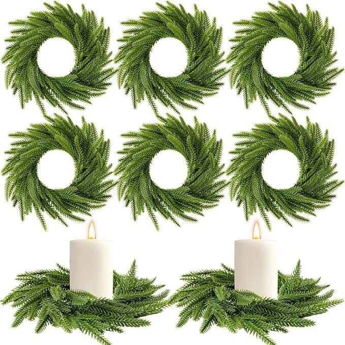 christmas wreaths with white candles and green leaves on the top, set of four