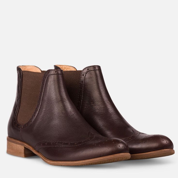 "These brogue Chelsea boots are a fantastic addition to your wardrobe. These smooth leather boots have brogue detailing on the toe and brown elasticated ankle panels for a sophisticated androgynous look. Outer material and lining - leather, sole - synthetic, closure - slip on. Heel - 2.5 cm / 1.0\" --------Size Conversion & Feet Measurements------ EU 34 US 4.0 UK 1.0 | 22.5 cm / 8.85\" EU 35 US 5.0 UK 2.0 | 23.0 cm / 9.05\" EU 36 US 6.0 UK 3.0 | 23.5 cm / 9.25\" EU 37 US 6.5 UK 4.0 | 24.5 cm Classic Heeled Boots With Leather Sole And Medium Width, Classic Heeled Boots With Leather Sole, Classic Ankle-high Chelsea Boots With Leather Sole, Classic Ankle-high Chelsea Boots With Rubber Heel Cap, Classic Heeled Boots With Rubber Heel Cap, Classic Ankle Boots With Reinforced Heel, Classic Medium Width Ankle Heeled Boots, Classic Round Toe Heeled Boots For Work, Classic Heeled Boots With Round Toe