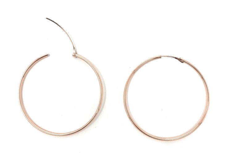 These may look like ordinary endless hoop earrings, but their tiny wire build holds a convenient little secret: they’re actually hinged. You just pull the post up and away from the hoop, insert it in your ear easily, and then slip the post into the tube in the back of your ear. It’s what everyone wants yet they are so hard to find! This hinged hoop combines the look of a traditional endless hoop with the easy-to-wear convenience of a hinged design. Perfect as a beginner’s earring for young child Adjustable Rose Gold Hoop Earrings, Everyday Rose Gold Hoop Earrings, Rose Gold Metal Hoop Earrings, Rose Gold Small Hoop Earrings, Small Hoop Earrings In Rose Gold, Nickel-free Rose Gold Hoop Earrings, Everyday Rose Gold Pierced Hoop Earrings, Adjustable Small Hoop Earrings In Rose Gold, Adjustable Nickel Free Rose Gold Hoop Earrings