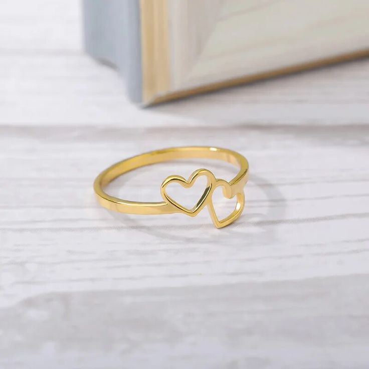 Discover Timeless Elegance and Romance Embrace the essence of love and sophistication with our Heart-Shaped Love Ring, crafted to perfection for the modern woman. Combining the durability of stainless steel with the warm tones of copper, this ring captures the heart of bohemian and romantic styles. Whether you're walking down the aisle or stepping out for a night on the town, this piece is designed to make a statement of love and fashion. Product Features Material Excellence: Crafted from high-q Round Rings, Two Hearts, Wedding Fashion, Romantic Style, Love Ring, Love Symbols, Contemporary Fashion, Elegant Woman, Modern Woman