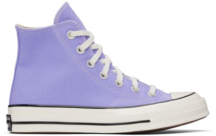 High-top cotton canvas sneakers in purple. · Round rubber cap toe · Lace-up closure · Eyelet vents at inner side · Logo patch at inner side · Rubberized logo patch at heel · Ortholite® insole · Treaded rubber sole · Contrast stitching in white Supplier color: Ultraviolet/White/Black Lavender Converse, Cute Converse Shoes, Purple Converse, Cute Converse, Preppy Shoes, Vintage Sneakers, Black Converse, Purple Shoes, Cute Nikes