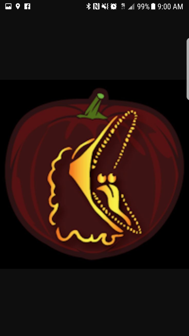 an orange and yellow pumpkin with the letter k on it's side, in front of a black background