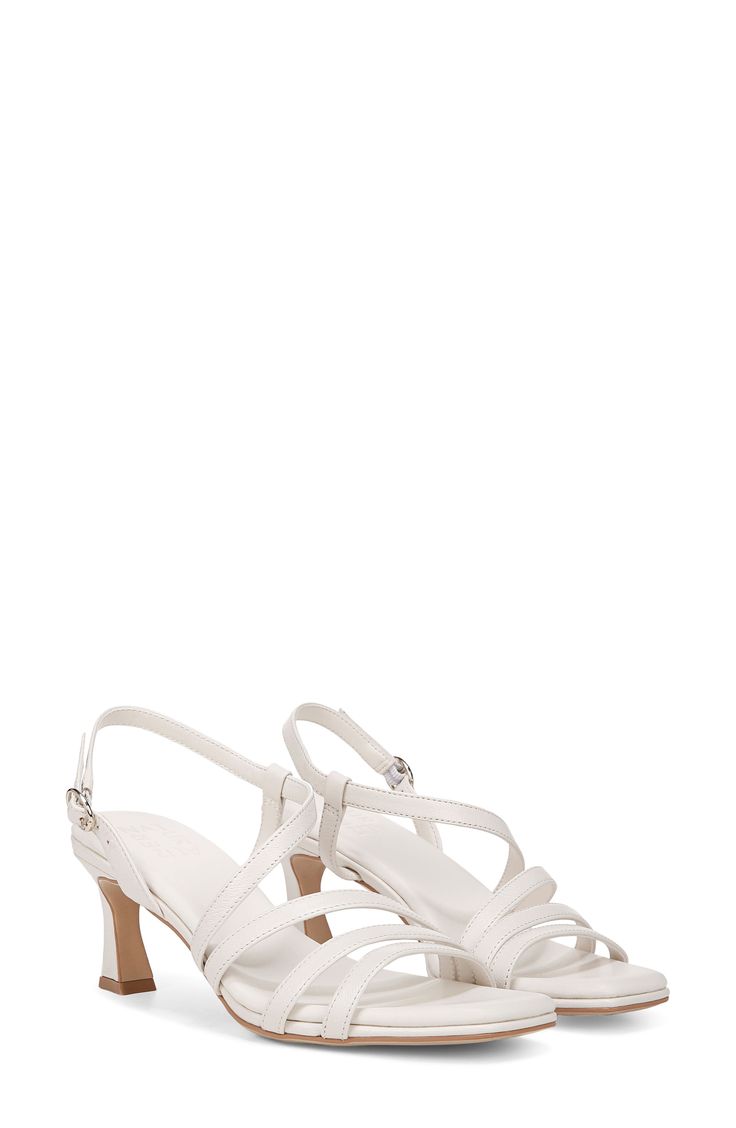 Asymmetric vamp straps lend modern dimension to an elegant sandal set on a cushioned footbed and flared heel. 2 1/4" heel Adjustable slingback strap with buckle closure Cushioned footbed with Contour+ technology Synthetic upper, lining and sole Imported Elegant Sandals, Slingback Sandal, Sandal Women, Warm White, White Leather, Womens Sandals, Nordstrom, Buckle, Size 6