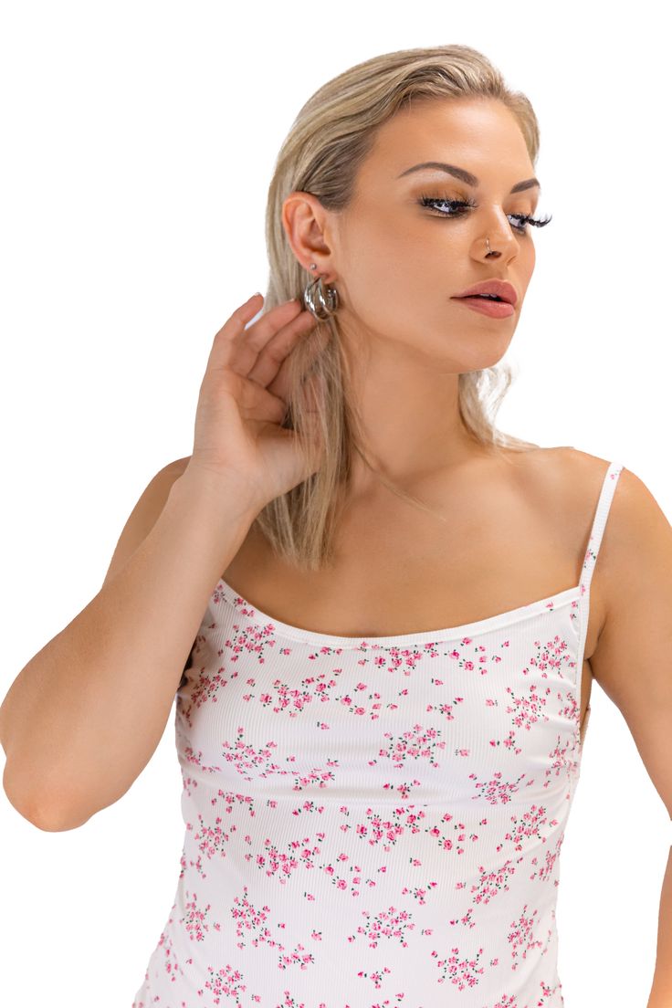 Embody the essence of spring with our "Blossom Embrace" mini dress. Featuring a delicate floral pattern on ribbed fabric, this dress boasts spaghetti sleeves and a captivating silhouette, ensuring you're the centerpiece of any event. White Mini Dress With Built-in Bra For Spring, Spring Mini Dress With Built-in Bra And Straight Neckline, Floral Print Cami Mini Dress For Party, Party Cami Mini Dress With Floral Print, Spring Feminine Mini Dress With Built-in Bra, Spring Mini Dress With Built-in Bra, Spring White Mini Dress With Delicate Straps, White Mini Dress With Delicate Straps For Spring, Pink Camisole Mini Dress For Spring