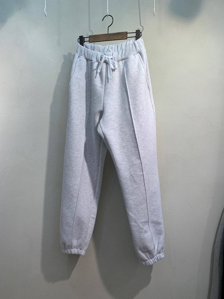 "Women's Woolen Fleece Sweatpants with relaxed fit Size One size, good for US size 4-12 Waist width 32cm Length 93cm inseam 66cm /26\" Fabric and Care Woolen fleece cotton 100% Machine washable and tumble dry Made in S Korea" Comfortable Sweats With Pockets And Straight Hem, Relaxed Fit Sweatpants With Drawstring For Winter, Relaxed Fit Drawstring Sweatpants For Winter, Solid Fleece Pants For Loungewear, Winter Baggy Pants With Drawstring, Casual Fleece Pants For Loungewear, Solid Color Fleece Lounge Pants, Baggy Drawstring Pants For Winter, Gray Sweatpants With Pockets For Loungewear