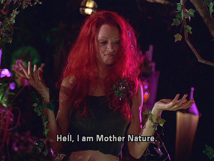 a woman with long red hair standing in front of a tree and saying hell, i am mother nature