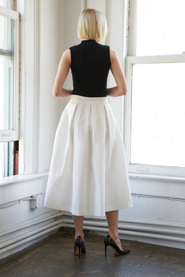 A solid woven full skirt with side zipper closureDetails:Self : 100% PolyesterSize & Fit- Model is 5`9" And Wearing Size Small- Measurements Taken From Size Small- Approx. Length: 35" Daywear A-line Lined Skirt, White Knee-length Skirt With Pleated Hem, Chic White A-line Pleated Skirt, White Pleated A-line Skirt, Chic Bottoms With Box Pleat For Spring, Chic Box Pleat Bottoms For Spring, White Fitted A-line Bottoms, Chic Cotton A-line Pleated Skirt, Chic Bottoms With Pleated Hem Full Skirt