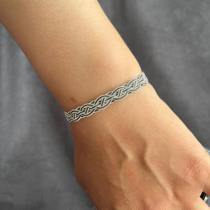 Add a touch of elegance to your loved one's outfit with these unique silver Sami twisted jewelry pieces. Our woven and braided bracelets, featuring double colors, make for the perfect wedding gift for a wife or a special gift for her. Each Sami armband is carefully crafted with attention to detail, ensuring a stunning accessory that will be cherished for years to come. Elevate her style with these exquisite bracelets that she'll love to wear on any occasion. Home page of all models; https://love Adjustable White Gold Promise Jewelry, Handmade Silver Braided Bracelet Gift, Silver Jubilee Braided Bracelet As Gift, Adjustable Sterling Silver Bangle For Anniversary, White Gold Sterling Silver Braided Bracelet For Gifts, White Gold Sterling Silver Braided Bracelet As Gift, Silver Sterling Silver Bracelets For Promise, Silver Bangle Jewelry For Promise, White Gold Jubilee Braided Bracelet As A Gift