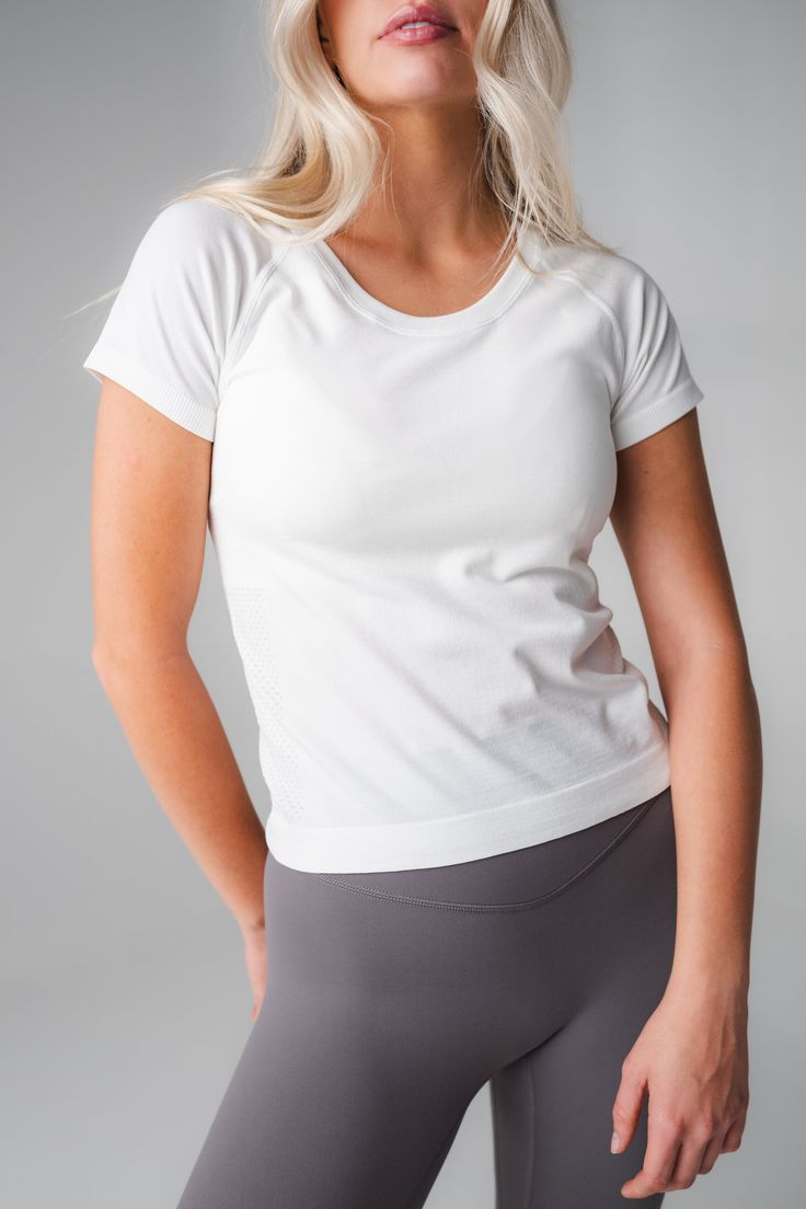 Our Energy Tee is designed for high performance activities as well as for on the go. This seamless short sleeved tee is fitted yet flexible and hits at the top of the waistband. High Stretch Crew Neck T-shirt For Sportswear, Functional Short Sleeve T-shirt For Light Exercise, Athleisure Compression Crew Neck T-shirt, Breathable Short Sleeve T-shirt For Light Exercise, Fitted Breathable T-shirt For Athleisure, High Stretch Athleisure T-shirt For Workout, Breathable Relaxed Fit T-shirt For Athleisure, White Short Sleeve Workout T-shirt, High Stretch Go-dry Crew Neck T-shirt