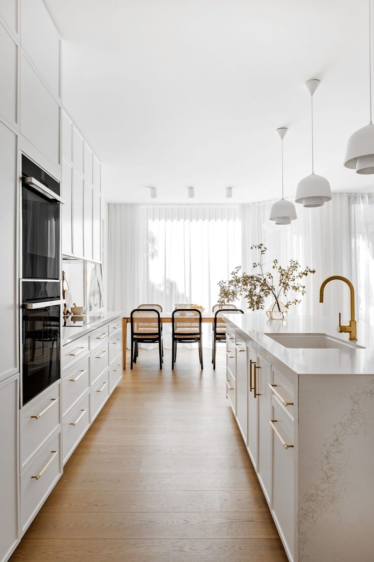 the kitchen is clean and ready to be used for cooking or dining, as well as two chairs