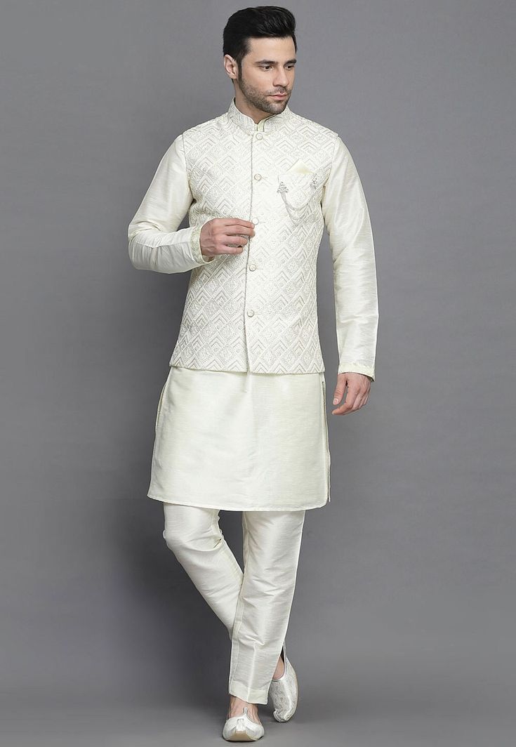 Art Silk Kurta in Off White.This Readymade attire is Enhanced with Buttons, Resham and Sequins Work. Crafted in Chinese Collar Neck and Full Sleeve.Available with an Art Silk Pajama in Off White and an Art Silk Nehru Jacket in Off White.  Do note: Brooch and Footwear shown in the image is for presentation purposes only. Half to one inch may vary in measurement. (Slight variation in actual color vs. image is possible)                        We sell all kinds of Menswear. Mens Kurta | Mens Kurta P Luxury Off-white Nehru Jacket For Men, Off White Sets With Zari Work For Transitional Season, White Eid Choli With Self Design, White Sherwani With Self Design For Puja, White Semi-stitched Nehru Jacket For Festivals, White Self-design Sherwani For Puja, Off White Designer Wear Sets For Transitional Season, Festive White Semi-stitched Nehru Jacket, Cream Long Sleeve Nehru Jacket For Diwali