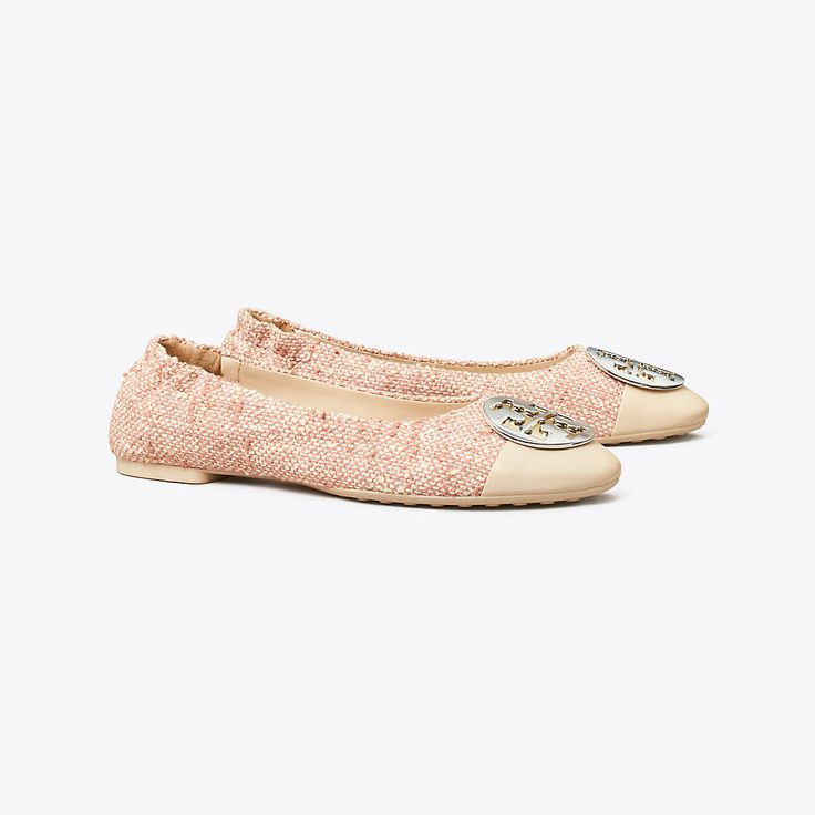 A classic, reimagined. Named for American designer Claire McCardell who introduced ballet flats in the 1940s and empowered women by breaking fashion rules. The Claire Ballet Flat pairs modern elements — a high vamp, metal hardware and contrasting cap toe — with discreet details designed for superior comfort — an extra-padded footbed and rubber pods. A ruched heel adds a gentle grip, advancing the long-lasting wearability of our elegant flat. Classic Spring Cap Toe Flats, Spring Cap Toe Flats, Branded Insole Ballet Flats For Fall, Luxury Slip-on Ballet Flats For Spring, Designer Flats For Spring, Fitted Ballet Flats With Removable Insole, Fitted Fall Ballet Flats, Designer Spring Ballet Flats With Leather Sole, Designer Ballet Flats For Spring