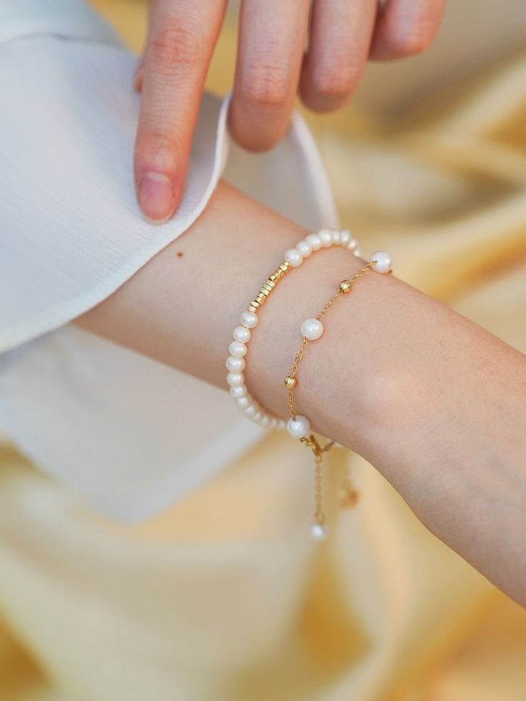 Adorn yourself with genuine freshwater luster pearls bracelet on a gold chain accented with gold beads. These classic pieces exude timeless elegance, perfect for wearing alone or layering with more pearls and chains for a stunning look. 💖Please be aware that natural pearls may exhibit variations in shape and minor surface irregularities, serving as evidence of their organic origin. ✨Specifications: Style 1 - Length: Adjustable, up to 20cm - Pearl: Natual freshwater baroque  - Metal: 14K gold pl Pearl Bracelets With Tiny Beads For Wedding, Gold Pearl Bracelet With Tiny Beads For Weddings, Wedding Pearl Bracelets With Tiny Beads, Elegant Pearl Beaded Bracelets With Tiny Beads, Elegant Pearl Beaded Bracelet With Tiny Beads, Elegant Beaded Pearl Bracelet, Gold Minimalist Beaded Bracelet With Pearl Chain, Elegant Pearl Bracelet With Beaded Chain, Minimalist Gold Beaded Bracelets With Pearl Chain