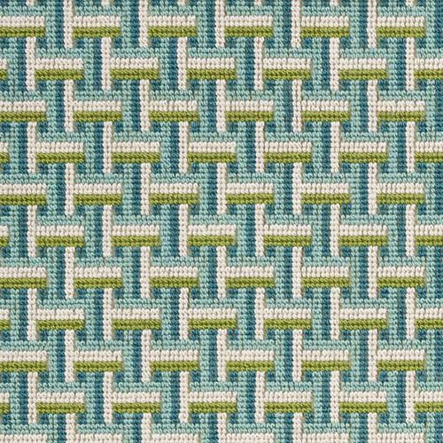 a blue and green woven fabric with small white squares on the top, in an abstract pattern