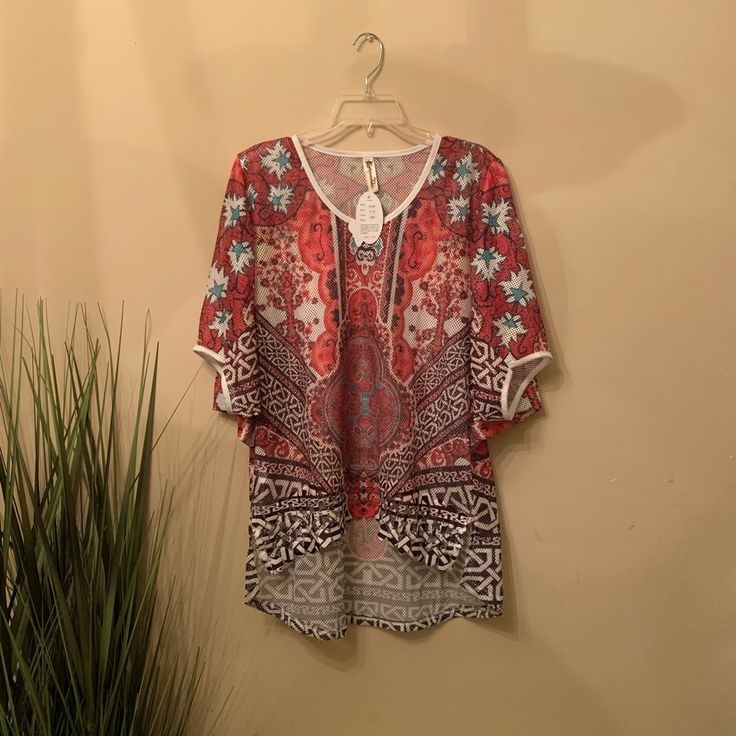 Multicolored Short Sleeve Mesh Top. Beautiful Design. Can Be Worn As A Top Or As A Bathing Suit Cover Up. L/Xl Chest: 23” Length: 25” - 32��” Red V-neck Top For Beach Season, Casual Multicolor Print Blouse For Vacation, Casual Beach Blouse With Boho Print, Red V-neck Tops For Beach Season, Colorful Patterned Blouse For Beach In Summer, Casual Boho Print Blouse For Beach, Colorful Pattern Summer Beach Blouse, Colorful Summer Beach Blouse, Red Bohemian Blouse With Paisley Print