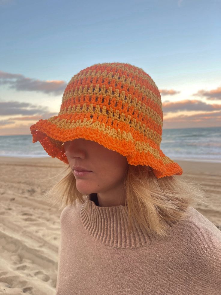 This crochet bucket hat is made by hand! The material is light and soft so perfect for a day at the beach, a fashion piece and even to keep you warm. Cotton Sun Hat, Summer Crochet Hat One Size In Yarn, One Size Crochet Yarn Hat For Summer, One Size Summer Crochet Hat, Lightweight Crochet Hat For Warm Weather, Spring Crochet Yarn Beach Hat, Knitted Beach Hat Made Of Yarn, Casual Crochet Straw Hat, Summer Yarn Bucket Hat One Size