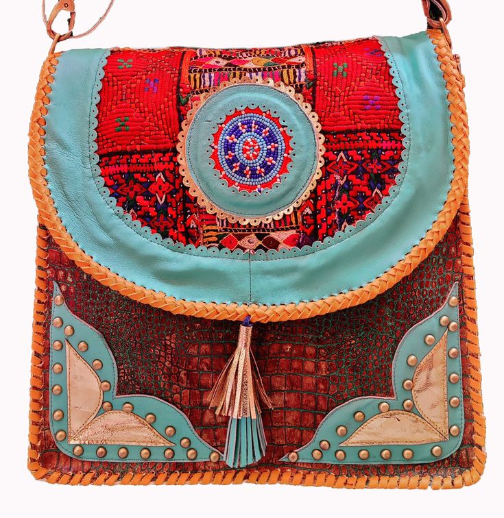 Item Description Available in Wholesale around You will get as much Pisces as you want around 50 pic, Indian Bohemian Crocodile Printed 100% Leather Bag Boho Bag Vintage Banjara Afghani Handmade Embroidery Mirror Work Bag Triba Shopping Shoulder Bag BANJARA ETHNIC VINTAGE EMBROIDERY HANDMADE TRIBAL BOHO SHOULDER BAG Walk on the wild side with this gorgeous clean new Banjara embroidered Crocodile Printed 100% leather tote bag from India. One of a kind! Stunning Crocodile Printed design, hand embr Traditional Crossbody Bag With Multicolor Embroidery, Traditional Multicolor Embroidered Crossbody Bag, Luxury Embroidered Crossbody Bag, Handmade Blue Shoulder Bag For Festivals, Embroidered Leather Travel Bags, Handmade Festival Pouch Bags, Festival Multicolor Embroidered Crossbody Bag, Embroidered Leather Satchel Bag, Rectangular Handwork Festival Bag