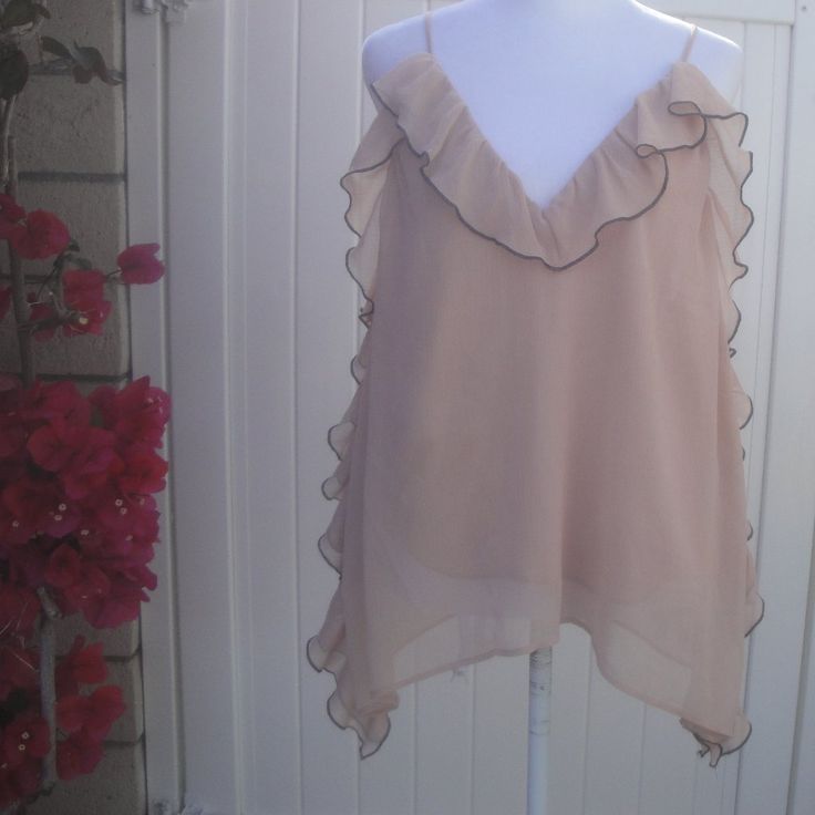 Zara Sleeveless Top Frilly Feminine New With Tags Size Large Soft Feminine Frilly Flirty With Ruffles Sleeveless Spaghetti Straps Top New By Zara Large Size: Large 22.5" Pit To Pit 16"Underneath To Hem Fabric:100% Polyester Condition: New Or New With Tags Item#0209-Peach-Orange Bins Weight: 5oz Check Out My Closet To Find More Great California Style Clothing! Feel Comfortable Purchasing From Me I Am A 5-Star Posh Ambassador Ii With Same Or Next Day Shipping ** Get $10 In Posh Credit By Entering Zara Sleeveless Top, Cowl Neck Shirt, Lace Bell Sleeve Top, Zara Bodysuit, Flirty Tops, White Lace Blouse, Soft Feminine, Orange Blouse, Spaghetti Strap Top