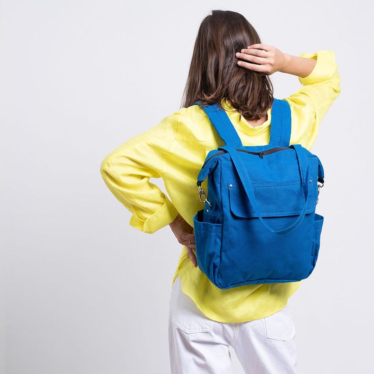 a woman with a blue backpack on her back