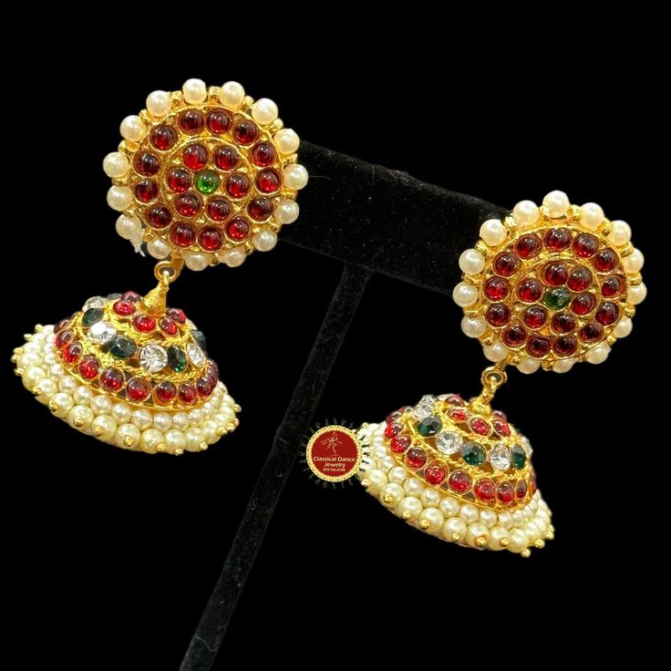 Design by Classical Dance Jewelry® ❥ Colorful and Designer traditional big pearl top and normal butta or jhumka Kemp temple Indian Jewelry Earrings in Red, Green stones combo ❥ Model no: EA-10 ❥ Age : 5 yrs and up ❥ You Can wear this set especially for Bharatnatyam And Kuchipudi Dance Performances and in Parties, Engagement, Weddings, Birthdays. ❥ Handmade Indian Item. ❥❥❥ Set includes ☛ Earrings pair ❇️ Imitation Jewelry by nature is little soft compared to real jewelry so little shape variatio Temple Jewelry Tikka For Eid Celebration, Temple Jewelry Style Tikka For Eid Celebration, Eid Celebration Temple Jewelry Tikka, Temple Jewelry Jhumkas For Festive Eid Occasions, Temple Jewelry Jhumkas For Festive Eid, Temple Jewelry Style Jhumkas For Eid, Temple Jewelry Bridal Earrings For Eid Celebration, Traditional Festival Jhumkas With Stone Work, Traditional Stone Work Jhumkas For Festivals