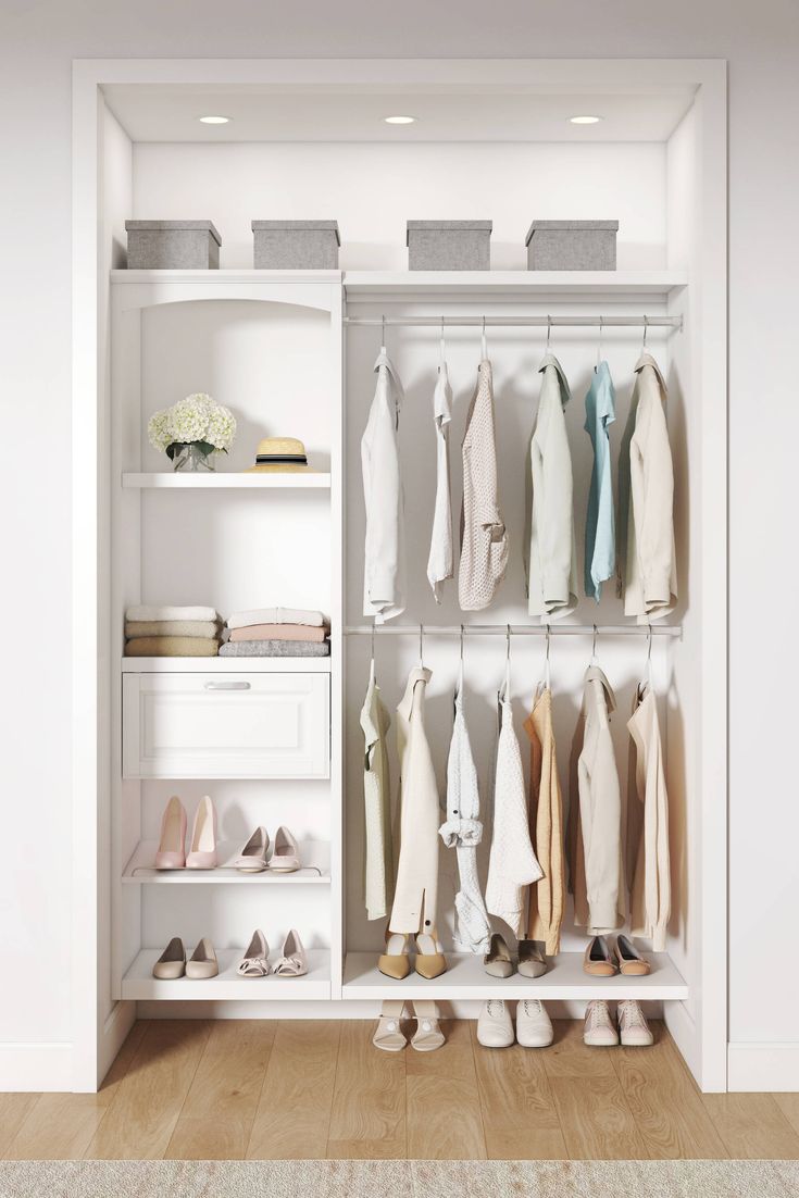 a white closet filled with lots of clothes and shoes