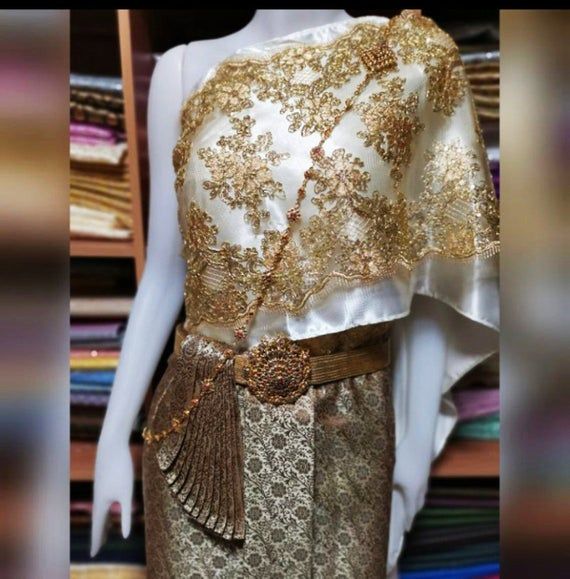 FREE Size: waist 22-32 inchSabai= width 14inchLength 3 metres(Comes with 2 pairs of hooks for the waist)PLUS Size:waist 33-45 inchSabais= width 17inchLength 3 metresJewerly set (including Earrings, Necklace, Body chain, Belt)***Please inform color every time you place an order.*** Traditional Gold Skirt For Party, Traditional Gold Party Skirt, Gold Traditional Party Skirt, Elegant Formal Skirt With Traditional Drape, Formal Fitted Skirt With Traditional Drape, Fitted Traditional Drape Wedding Skirt, Khmer Wedding Dress, Skirt Traditional, Silk Colors