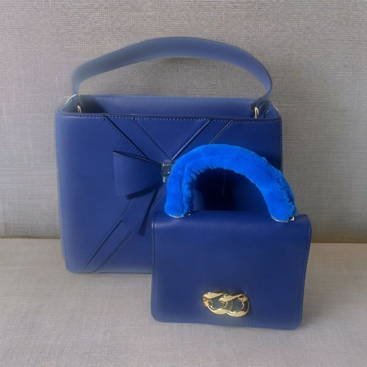 Elegant Quality Sturdy Handbag With Extra Mini Bag Inside, Crossbody Strap, 3 Compartments And Beige Interiors With Pockets. Height 10 In, Length 12 In, Width 5 In. Designer Blue Tote Box Bag, Designer Blue Handheld Satchel, Designer Blue Bag With Double Handle, Designer Blue Box Bag For Shopping, Designer Blue Box Shoulder Bag, Designer Blue Box Bag With Removable Pouch, Designer Blue Bag With Top Carry Handle, Designer Blue Box Bag For Everyday Use, Designer Blue Box Bag With Detachable Handle