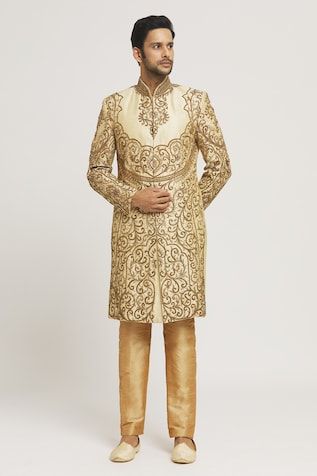 Gold sherwani with all-over zardozi and stone hand embroidery. Comes with gold pant. - Aza Fashions Semi-stitched Gold Kurta With Naqshi, Festive Gold Anarkali Set With Naqshi, Gold Churidar With Straight Kurta For Reception, Gold Straight Kurta Churidar For Reception, Festive Gold Anarkali Set With Naqshi Detail, Designer Gold Sets With Naqshi Detailing, Gold Sherwani With Zari Work For Designer Wear, Designer Wear Gold Sherwani With Resham Embroidery, Designer Gold Sherwani With Resham Embroidery