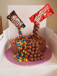 a birthday cake made to look like it has chocolate candies on top