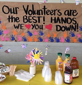 there is a sign that says our volunteers are the best hands down