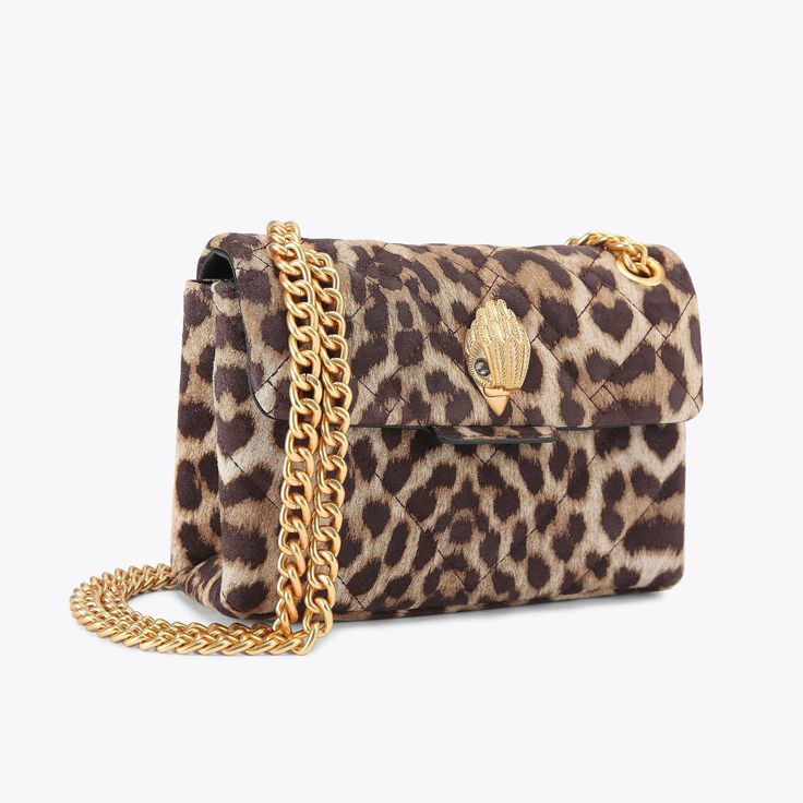 The Mini Leather Kensington is crafted from a leopard printed leather with signature parquet padded overstitch quilting. The brushed gold eagle head sits on the front flap.14cm (H), 20cm (L), 6cm (D)Strap drop cross body: 120cmStrap drop shoulder: 70cmBrushed gold metal chain strap Duo magnetic snap closure hidden under flapBrushed gold metal branded plate on the backCan fit phones up to 7 inchesSmall internal lining pocketOuter: Printed LeatherInterior: Monogrammed interior liningStyle num Luxury Tortoiseshell Rectangular Bags, Luxury Leopard Print Shoulder Bag With Gold-tone Hardware, Luxury Leopard Print Bags For Formal Events, Luxury Leopard Print Rectangular Bag, Luxury Leather Shoulder Bag In Leopard Print, Luxury Leather Bags In Leopard Print, Luxury Leather Leopard Print Shoulder Bag, Luxury Leopard Print Leather Bag, Kurt Bag