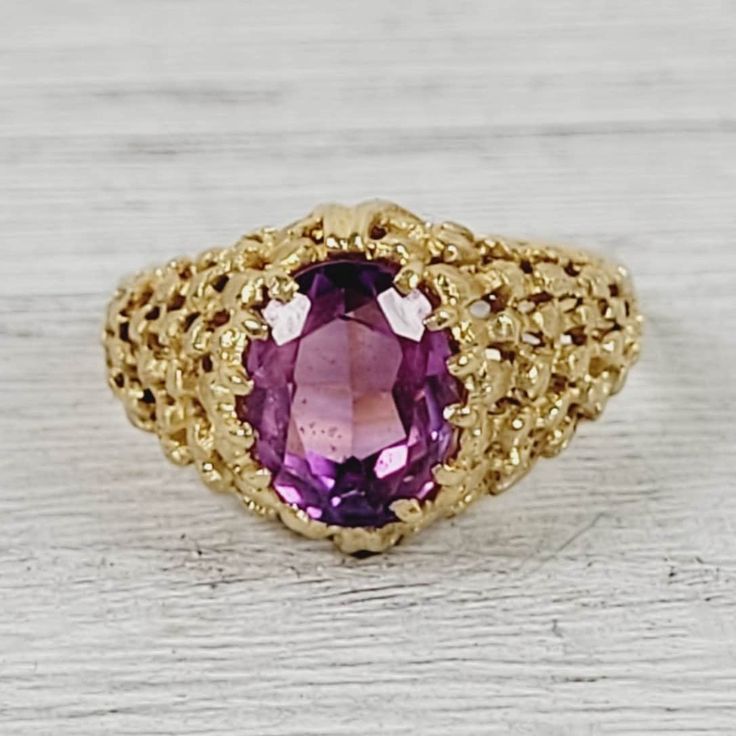 "L-1941  Vintage Purple Sapphire 18K Yellow Gold Ring 6 Retro 1960's Luxury Design Pretty  AMAZING VINTAGE 1960's SOLID 18K GOLD RING. SET WITH A PURPLE SAPPHIRE. WEAR ALONE ON WITH YOUR STACK. THE SHANK HAS SOME ROUGHNESS ON ONE SIDE. WONDERFUL COLOR & HIGHEST QUALITY. JUST PART OF MY MOST RECENT ESTATE FINDS! FOLLOW ME TO SEE THEM ALL!    Metal: 18K Yellow Gold Metal Purity: 18K Material: Sapphire Ring Size: 6 Other Dimensions: 1/2\"w Form: Ring Luxury Age: Vintage Weight (Grams): 5.3 IT IS IN EXCELLENT ESTATE CONDITION  ALL ITEMS LISTED AS GOLD ARE EITHER MARKED AND OR TESTED FOR CONTENT  TO HELP DETERMINE SIZE / SCALE OF PIECE THE QUARTER IS PICTURED AND MEASURES 24.16mm OR .95 INCHES    PLEASE DON'T BE AFRAID TO SEND AN OFFER, I AM NEVER OFFENDED & I LOVE GIVING DEALS!  The pictures a Vintage Yellow Gold Sapphire Ring Collectible, Vintage Yellow Gold Gemstone Ring, Vintage Yellow Gold Sapphire Ring, Vintage Yellow Gold Rings With Gemstones, Vintage Gold Sapphire Ring Stamped 14k, Vintage Yellow Gold Signet Ring With Gemstone, Vintage Yellow Gold Signet Ring With Center Stone, Vintage Gold Sapphire Ring For Anniversary, Vintage Gold Signet Ring With Gemstone