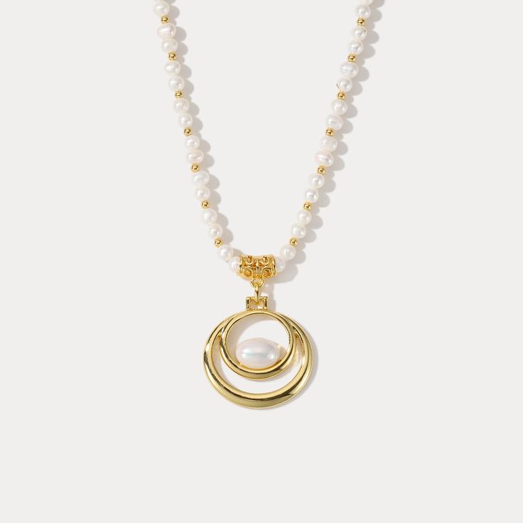 Adorn your neck with the remarkable elegance of our Oval Pearl Necklace. Crafted with 18k gold, this luxurious accessory will complete any ensemble with its timeless sophistication. With its alluring classic design, its sure to make a statement of timeless style. DETAILS Plating: 18K Gold Materials: 18K Gold on Brass, Freshwater Pearl Measurements: Length: 16.54"(42.0cm) + Extender: 2.36"(6.0cm) Weight:  36.59 g Elegant Gold-tone Necklace With Pearl Drop, Elegant Gold-tone Pearl Drop Necklace, Elegant Gold-tone Pearl Chain Necklace, Elegant Gold-tone Pearl Necklace For Gift, Gold Pearl Necklace With Pearl Pendant, Oval Gold Necklace With Pearl Chain, Elegant Long Gold Pearl Necklace, Gold Pearl Pendant Long Necklace, Gold Beaded Pearl Pendant Necklace