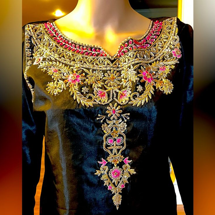 A Beautiful Black Pakistani Formal, Fancy 3 Piece Suit With Embroidered Shalwar And Finished Edges Duppatta. Satin Silk Fabric With Lining Underneath, Quality Work With Thread,Motives And Sequins.New Without Tag. Traditional Embellished Embroidered Dress For Designer Wear, Bollywood Embellished Embroidered Dress For Eid, Traditional Embellished Embroidered Festive Dress, Traditional Festive Embellished Embroidered Dress, Festive Bollywood Embellished Embroidered Dress, Semi-stitched Embellished Embroidered Dress For Festivals, Festive Semi-stitched Silk Embroidered Dress, Embellished Semi-stitched Embroidered Dress For Festivals, Elegant Semi-stitched Embellished Embroidered Dress