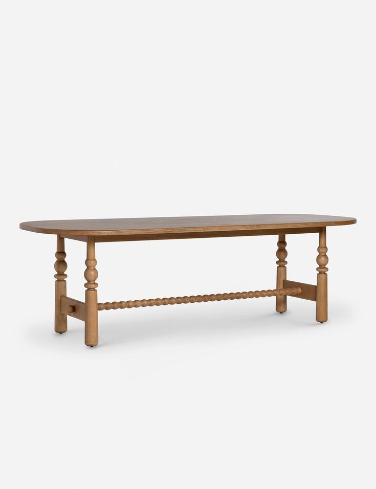 a wooden table with two legs and an oval shaped top, on a white background