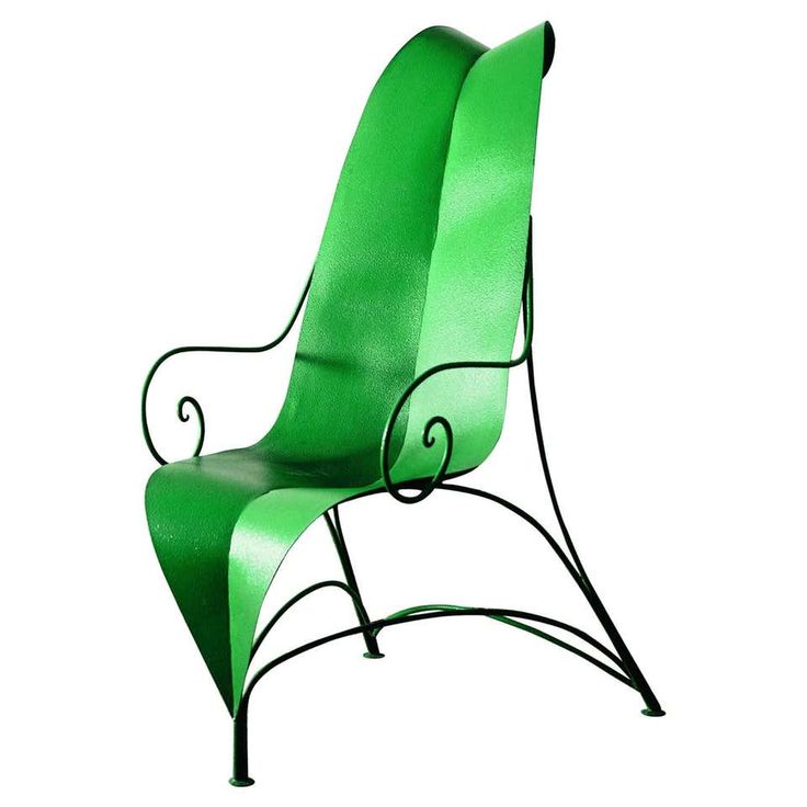 a green chair with black metal frame and curved back rests against a white background,