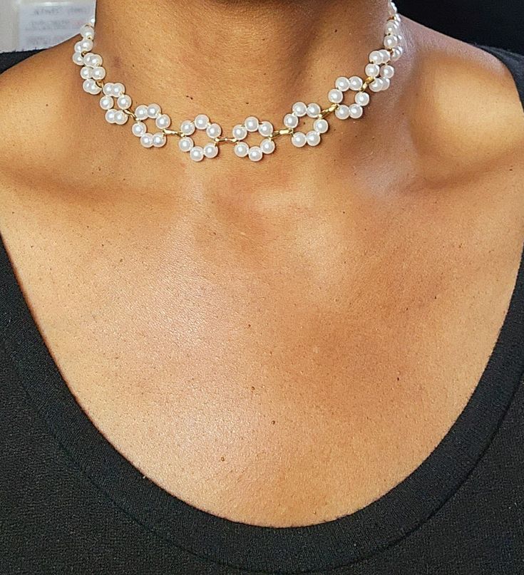 Whether you're attending a special occasion or simply want to feel fabulous, our Floral Pearl Choker is the perfect accessory to make a statement and leave a lasting impression. Embrace your inner charm and let this enchanting piece adorn your neck with sheer elegance. Chic Spring Wedding Jewelry, Chic Formal Metal Choker, Crystal Necklaces For Party, Elegant Pearl Jewelry For Parties, Elegant White Choker With Clavicle Chain, Round Crystal Necklaces For Party, Elegant Pearl Chain Choker For Party, Evening Pearl Chain Choker, Elegant Adjustable Jewelry For Spring