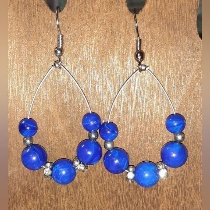 Blue & Silver Rhinestone Teardrop Wire Loop Dangle Earrings Made With Marbled Blue Acrylic Beads And Rhinestone Spacers. Teardrop Shape, Clear Coated Silver Wire Hypoallergenic Silver Tone Ear Hooks. 1.5" Long Handmade By Me! If You Have Allergies To Certain Metals, Please Message Me, And I Can Change Them Out At No Extra Charge. I Have Several Types Of Earring Components Available. Clip-On Converters Are Also Available Upon Request. Colors May Vary Due To Different Screen And Camera Settings. M Blue Dangle Hoop Earrings Hypoallergenic, Blue Teardrop Earrings For Party, Blue Nickel-free Hoop Earrings For Party, Blue Nickel-free Teardrop Earrings For Party, Nickel-free Blue Teardrop Earrings For Party, Blue Teardrop Hypoallergenic Hoop Earrings, Handmade Blue Teardrop Hoop Earrings, Blue Hypoallergenic Teardrop Hoop Earrings, Blue Dangling Beads Teardrop Earrings