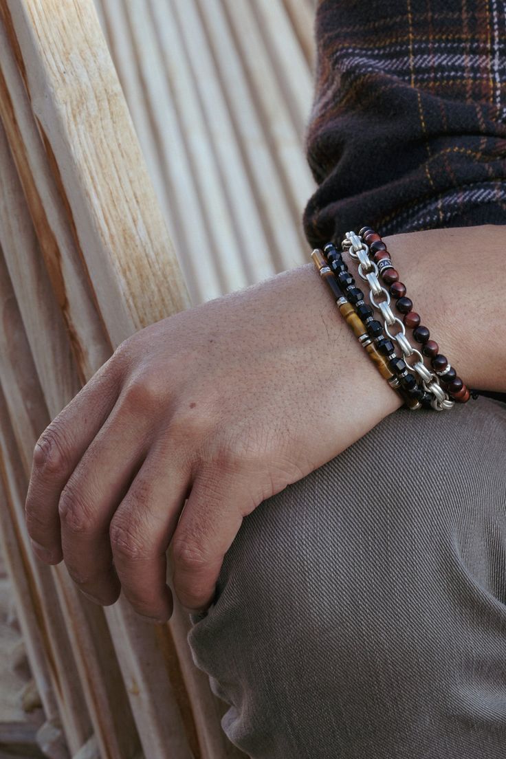 Handcrafted from 6mm Red Tiger's Eye, this bracelet features a Maya David silver bead and solid silver push clasp. An everyday piece that will add a touch of refinement to any look or stack. Sterling Silver Red Tiger's Eye 6mm Thickness Push Clasp Handcrafted in LA Red Tiger's Eye: Vitality, Protection, Emotional Balance, Stability Determining your bracelet size: Encircle your wrist with a flexible tape measure and record the measurement. Add 1/2 to 1 inch to your wrist measurement for a comfort Modern Gemstone Beads Bracelets, Modern Silver Bracelets With Gemstone Beads, Modern Silver Beaded Bracelets, Modern Sterling Silver Beaded Bracelet For Everyday, Modern Silver Jewelry With 8mm Beads, Modern Hand-strung Jewelry For Everyday, Modern Hand-strung Everyday Jewelry, Pearl Jewelry Gift, Red Tigers Eye