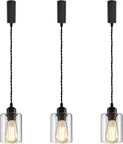 three glass pendant lights hanging from the ceiling