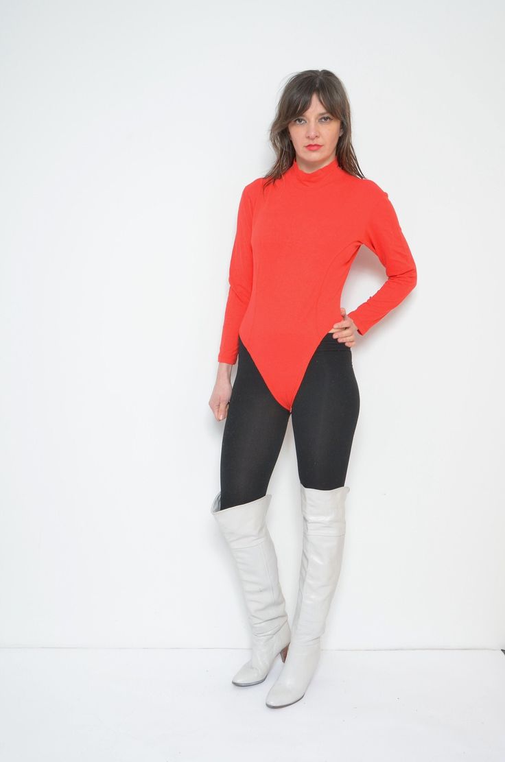 "Vintage 80s mock neck leotard. Long sleeve high neck bright red bodysuit blouse. Sports top. - Label: n/a - Era: 1980s - Color: red - Fabric: polyester - Condition: very good. Ready to wear. - Tag Size: cotton, lycra - Fits: medium MEASUREMENTS (stretchy): *Bust: 37\" (94 cm) *Waist: 30.7\" (78 cm) *From top of the shoulder to crotch: 25.2\" (64 cm) Model is 5.7 feet (174 cm) height." Solid Long Sleeve Leotard For Party, Solid Long Sleeve Party Leotard, Winter Stretch Long Sleeve Unitard, Winter Long Sleeve Stretch Unitard, Fitted Long Sleeve Fall Leotard, Tight Long Sleeve Unitard, Stretch Long Sleeve Leotard For Fall, Fitted Turtleneck Bodysuit For Fall, Fall Long Sleeve Stretch Unitard