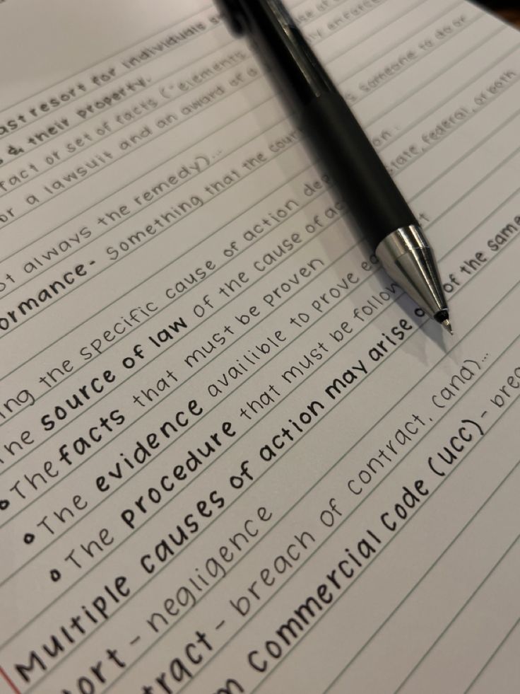 a pen sitting on top of a piece of paper