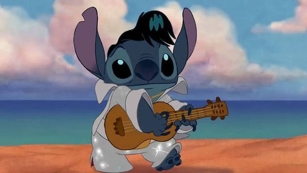 a cartoon character playing a guitar on the beach