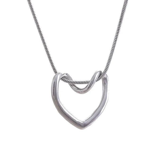 Celebrate love in all its forms with Chloe Heart Necklace. This captivating necklace features a delicate, hollow heart pendant, meticulously crafted from high-quality stainless steel with a timeless gold or silver finish.A perfect gift for yourself or a loved one, The Everlasting Love Necklace is a timeless reminder of the enduring power of love. Stainless steel with 18k PVD Gold or Sterling Silver Plating Delicate Hollow Heart Pendant Lightweight & Minimalist Adjustable Chain (16" + 2" Extender) Necklace Chain Types, Heart Shaped Pendant Necklace, Hollow Heart, Trendy Necklaces, Heart Shape Pendant, Stunning Necklace, Love Necklace, Heart Pendant Necklace, Stylish Accessories